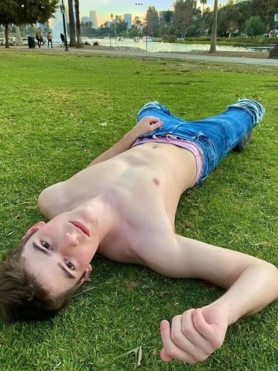 cute-brown-haired-boy-laying-on-lwn.jpeg