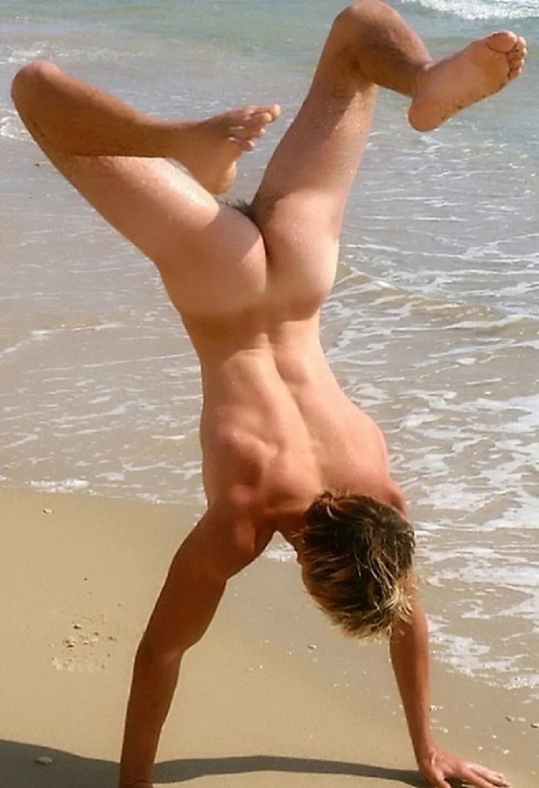 guy-doing-hand-stand-on-beach.jpeg