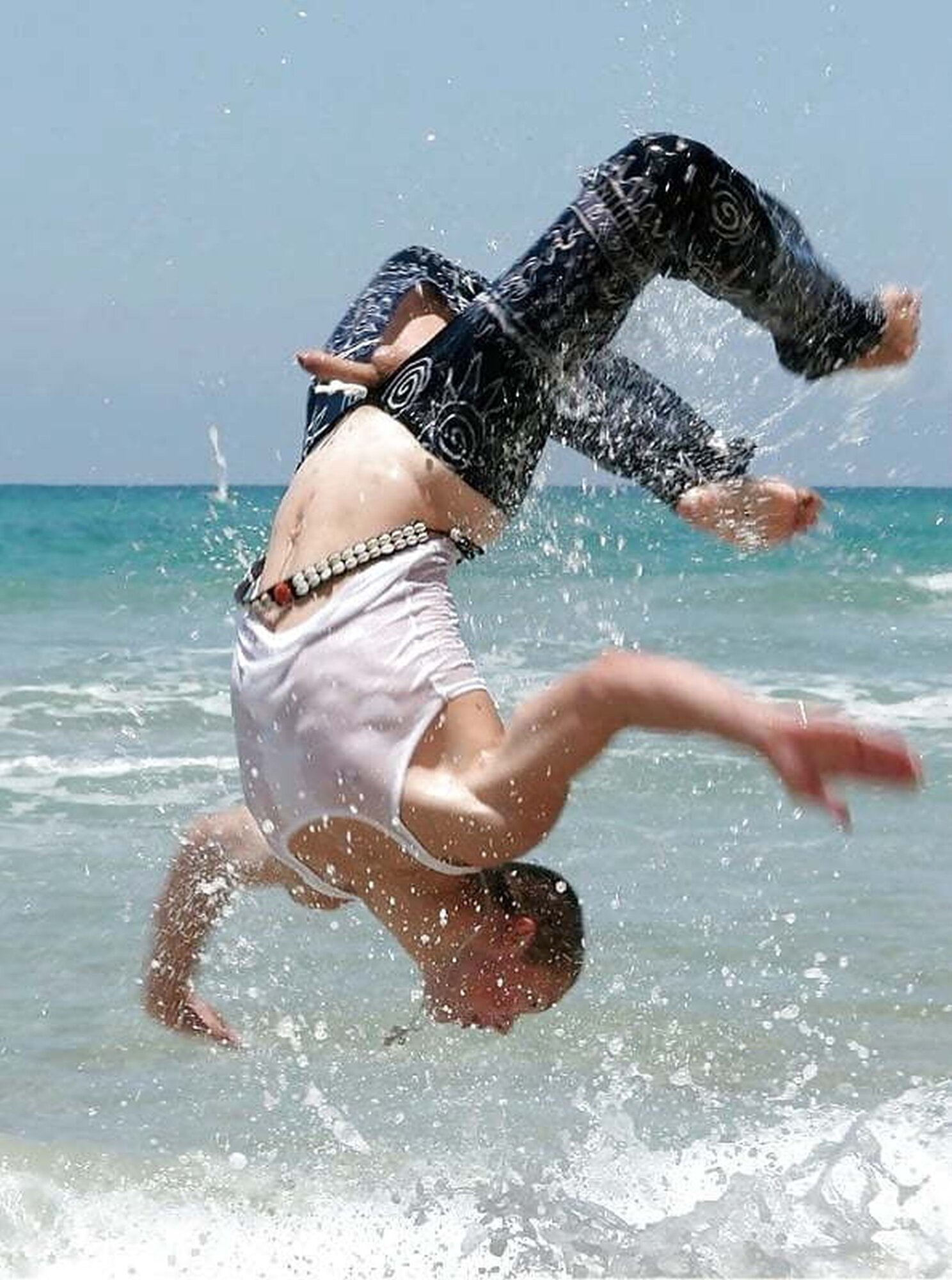 guy-flipping-in-ocean-cock-flys-out.jpg