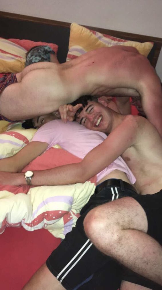 guys-wrestling-on-bed.jpeg