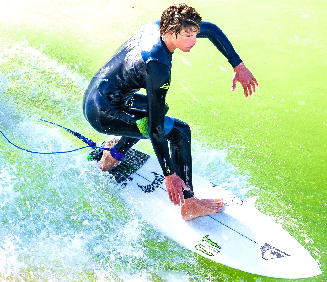 hot-guy-surfing-in-ocean.jpeg
