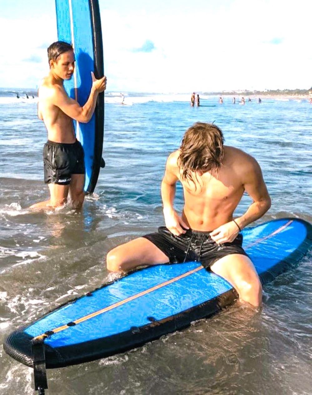 surfer-adjusting-his-swim-trunks.jpeg