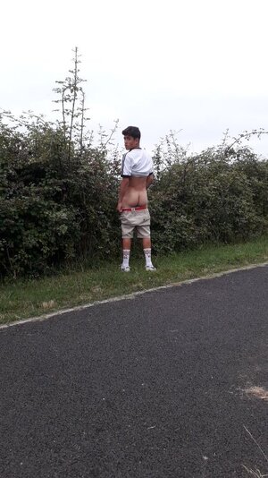 guy-peeing-on-side-of-road.jpeg